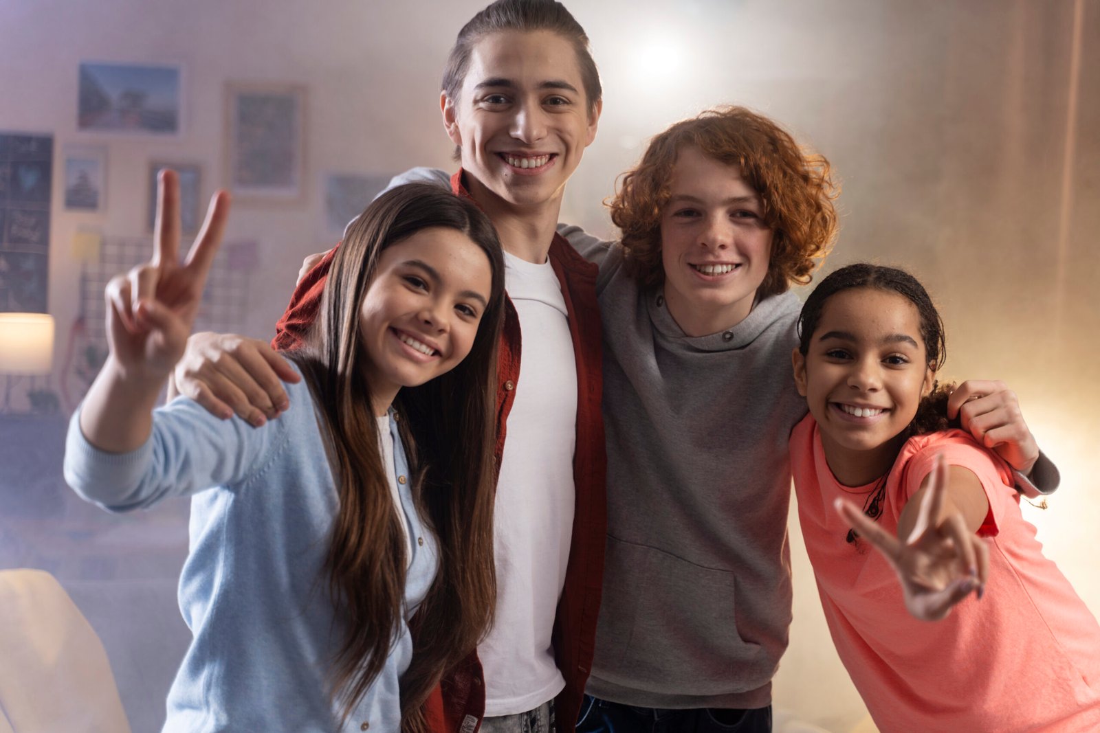group teenage friends posing together home party